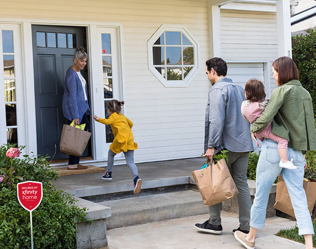 Family walking into a house